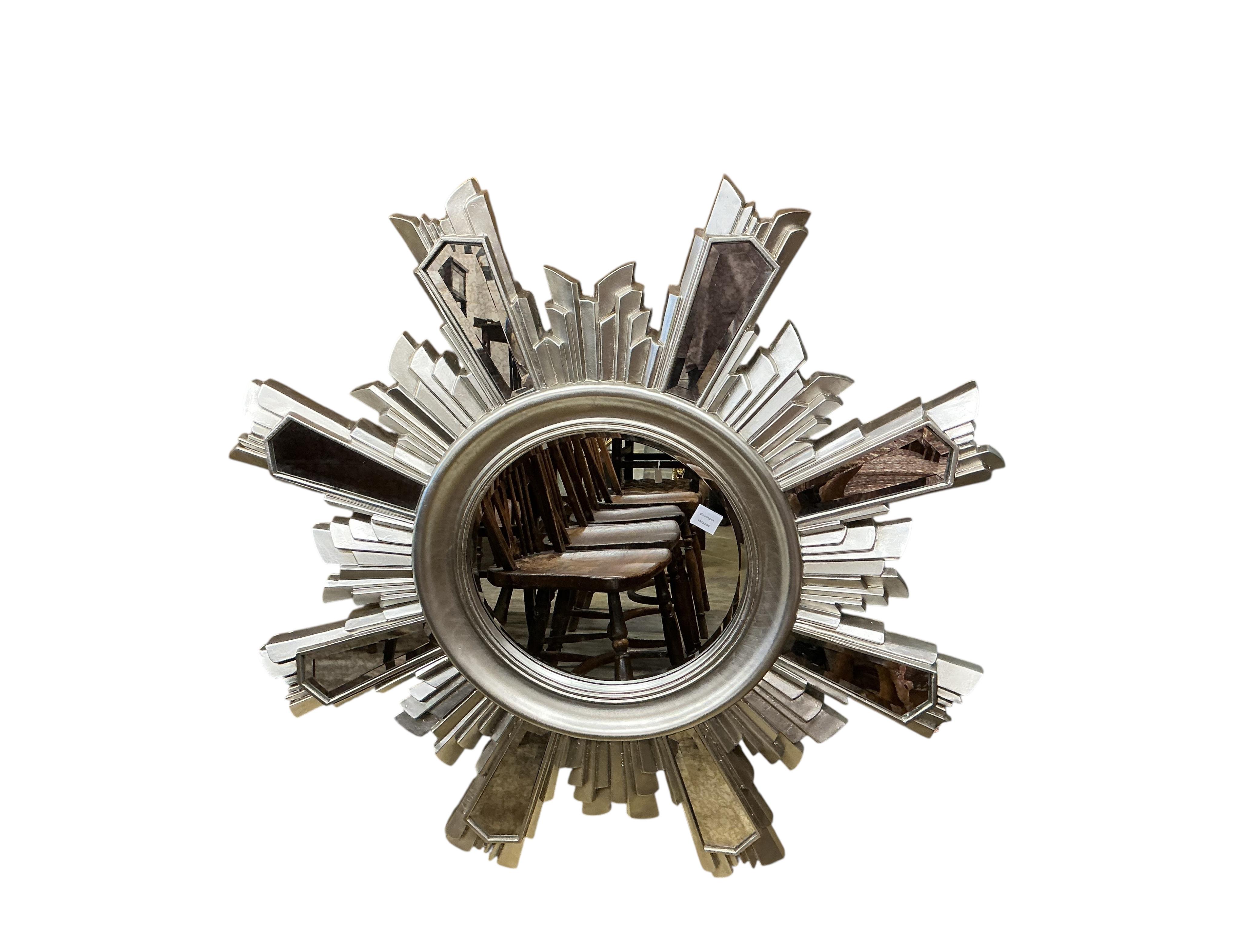 A Contemporary silvered sunburst wall mirror, diameter 116cm